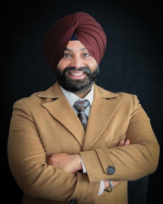 Portrait of Gurveer Mann, Associate.